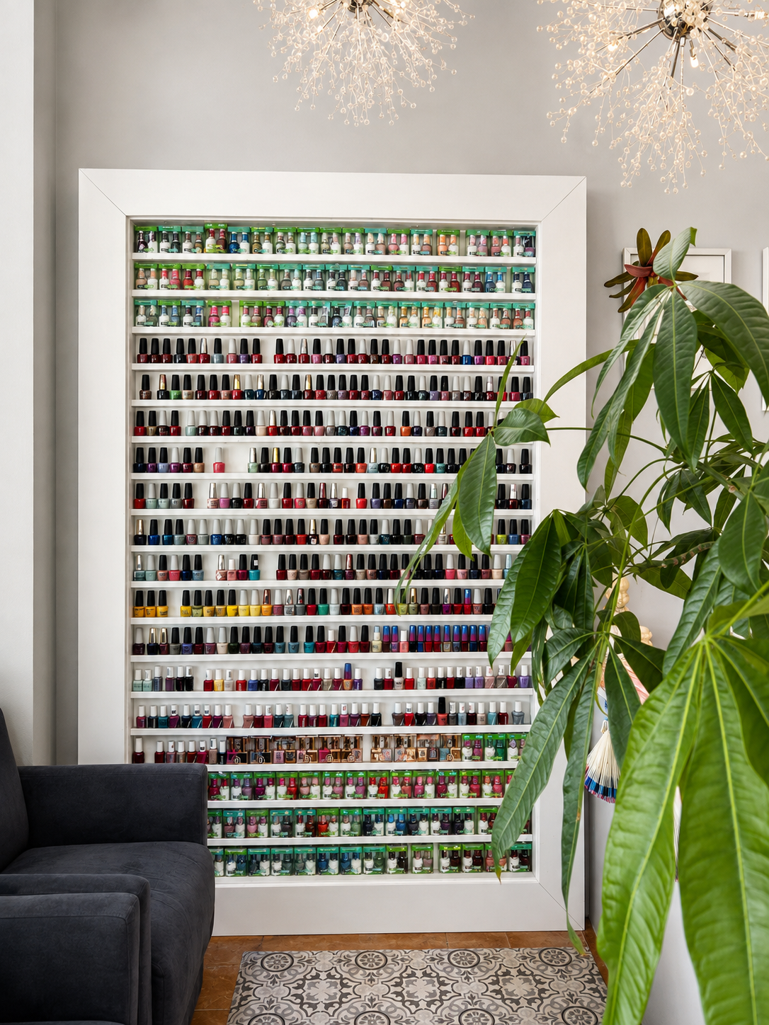 Floor-to-ceiling wall of nail polish colors at Garden Square Nails & Spa